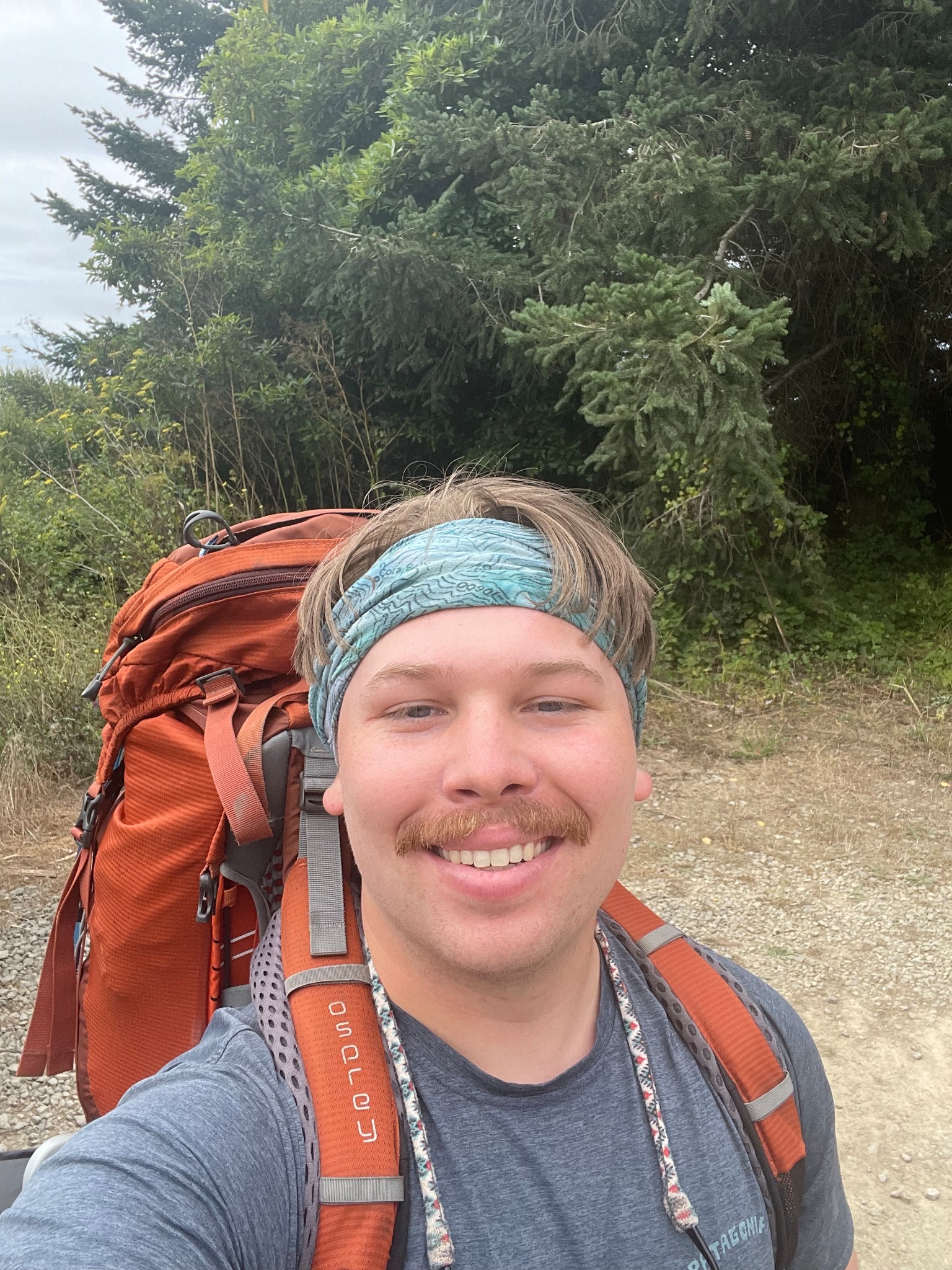 Dane hiking with a backpack on the trail
